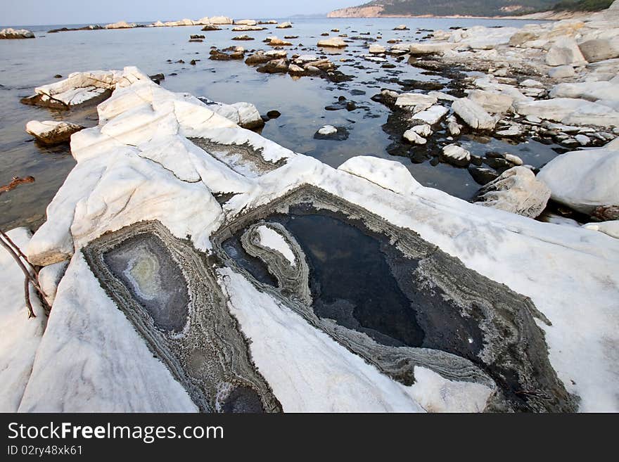 Blocks of marble in the sea on Aliki, Thassos island, Greece