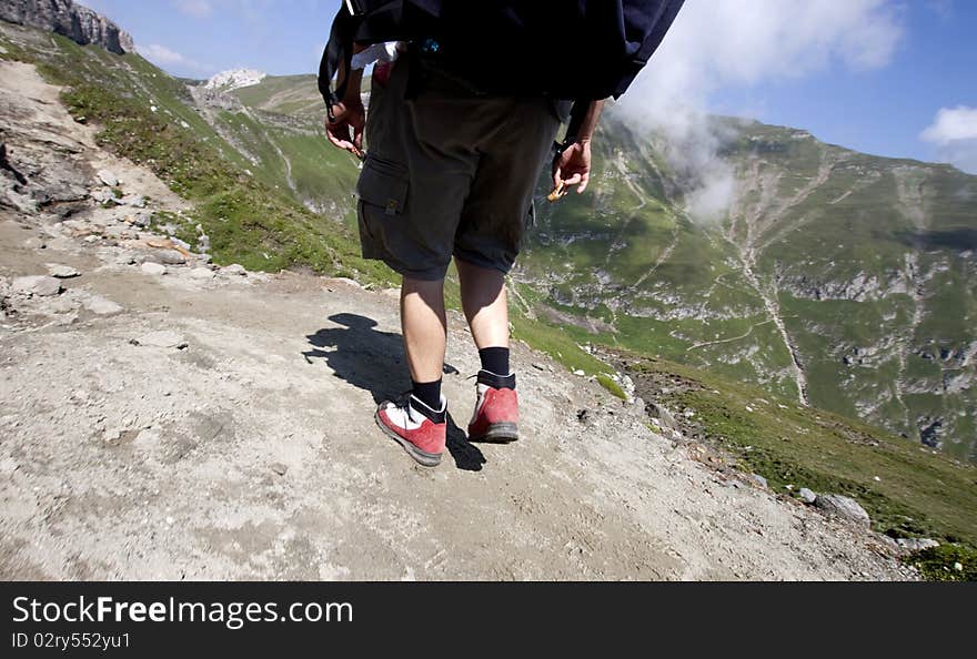 Man Trekking In Mountains