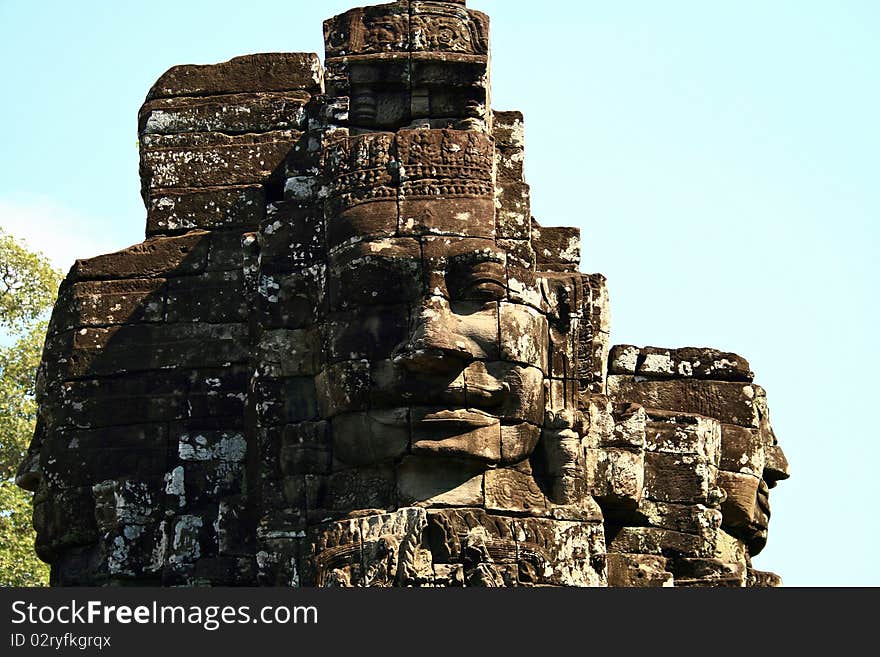 face tower of the king Jayavarman VII against blue sky in the temple of The Bayon, Angkor, Siem Riep, Cambodia.

. face tower of the king Jayavarman VII against blue sky in the temple of The Bayon, Angkor, Siem Riep, Cambodia.