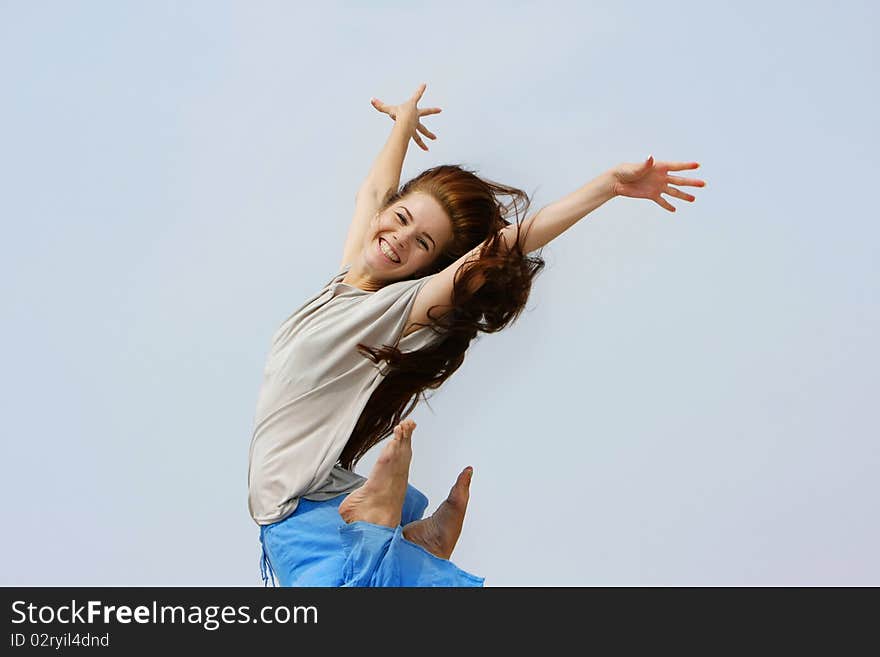 Happy girl jumping isolated