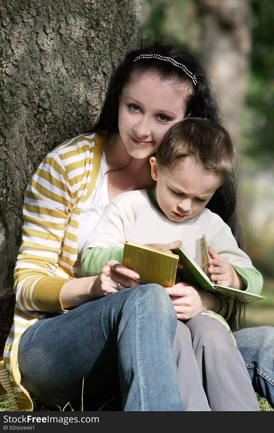 Mother and son reading book