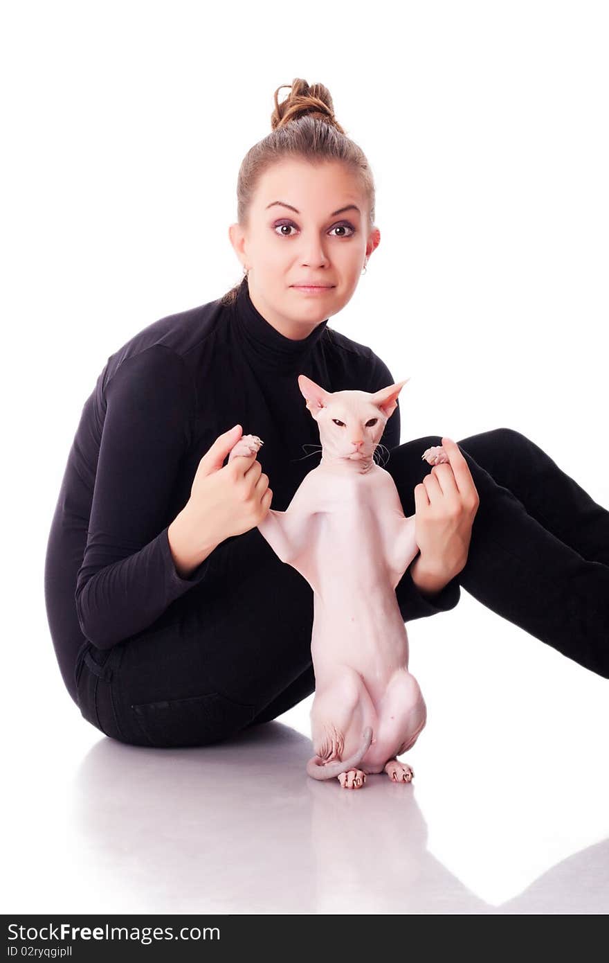 Beautiful young woman with a cat on a white background