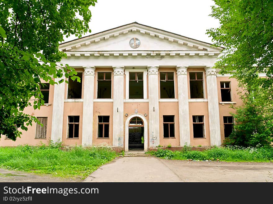 The photograph shows an abandoned Soviet House. The photograph shows an abandoned Soviet House