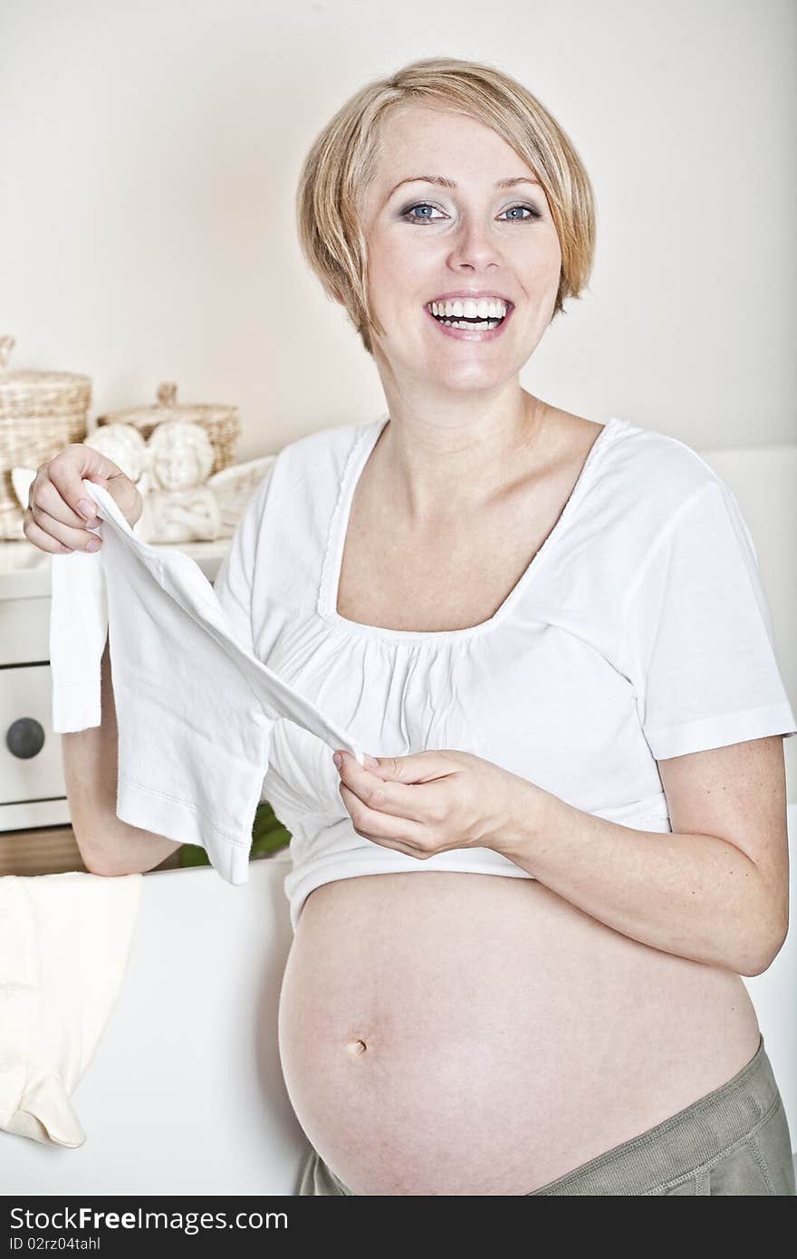 The mother prepares the baby-linen for the child