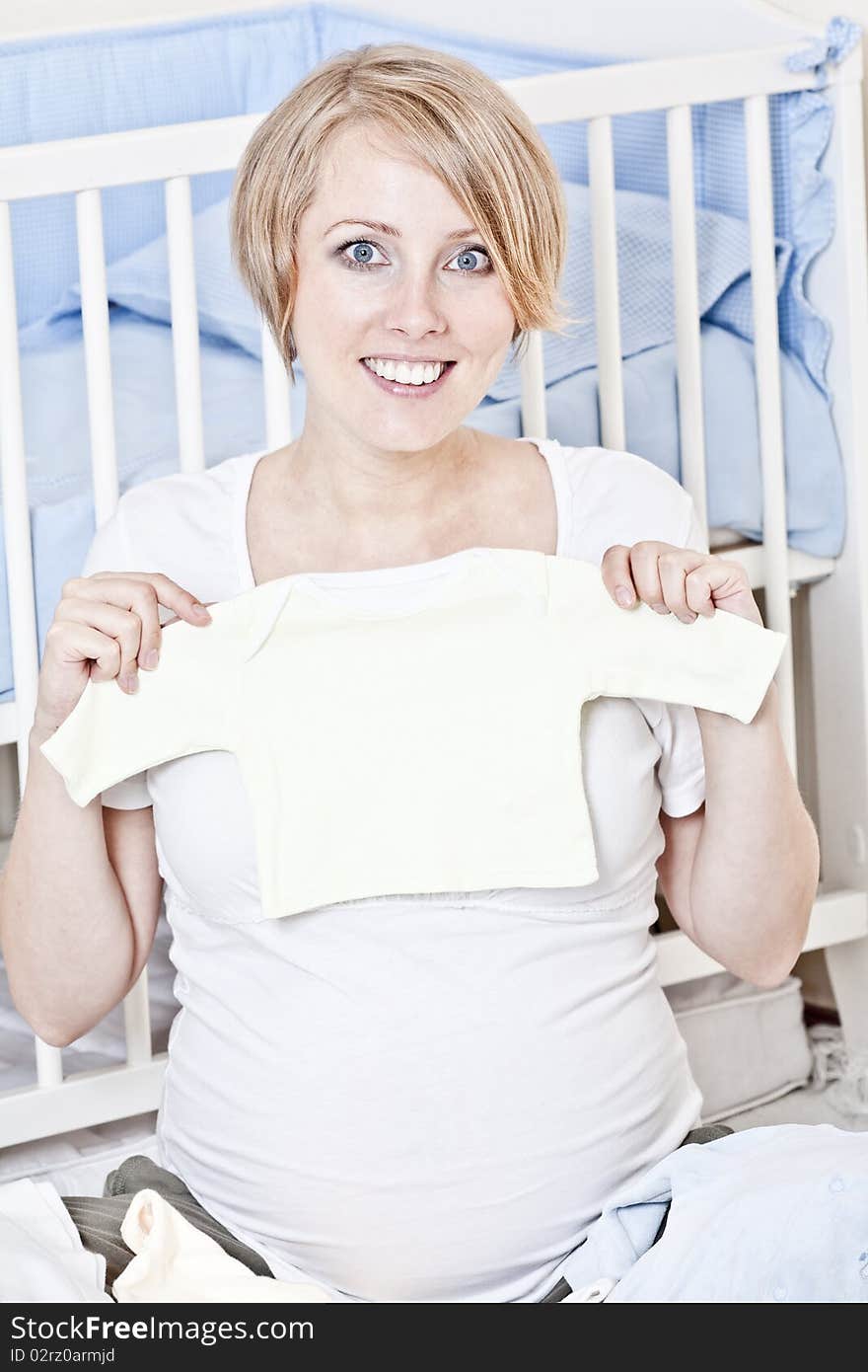 The mother prepares the baby-linen for the child