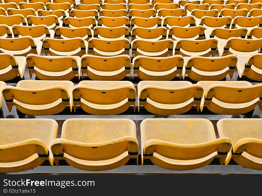 Yellow Seat Pattern in Football Stadium