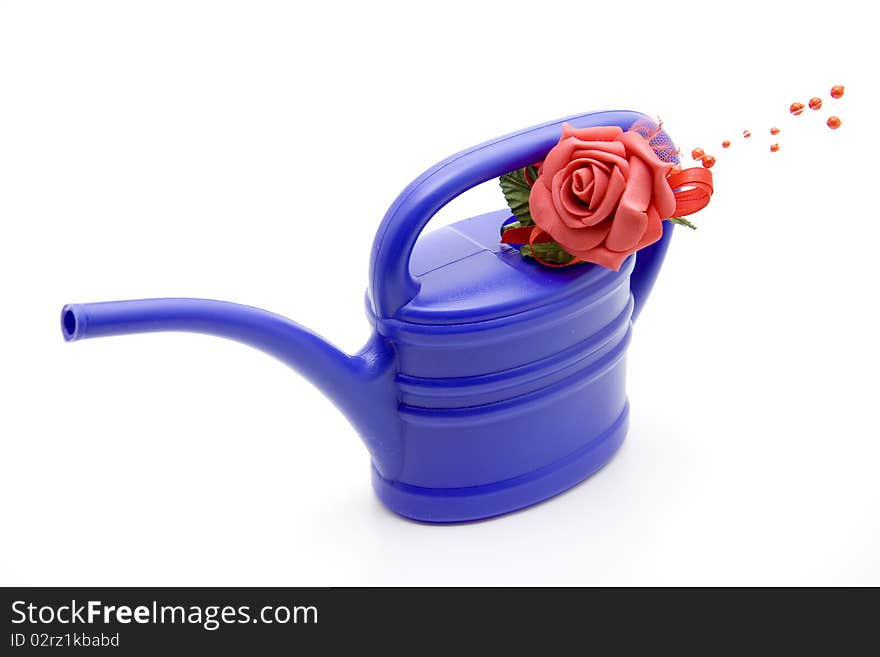 Blue plastic watering can with flower. Blue plastic watering can with flower