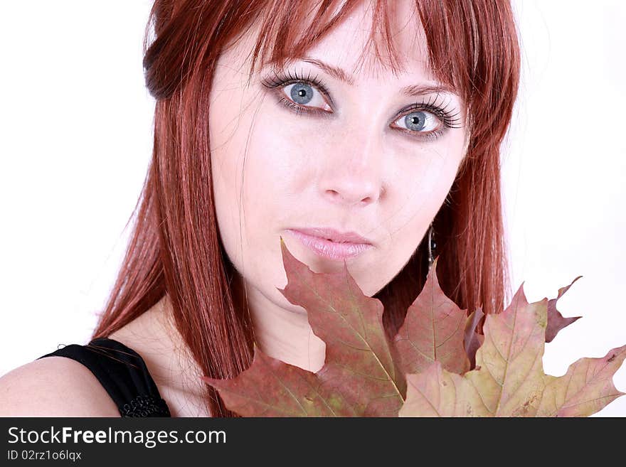 Beautiful young woman with red hair and maple leaves. Beautiful young woman with red hair and maple leaves