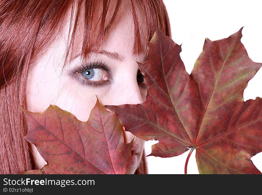 Beautiful young woman with red hair and maple leaves. Beautiful young woman with red hair and maple leaves