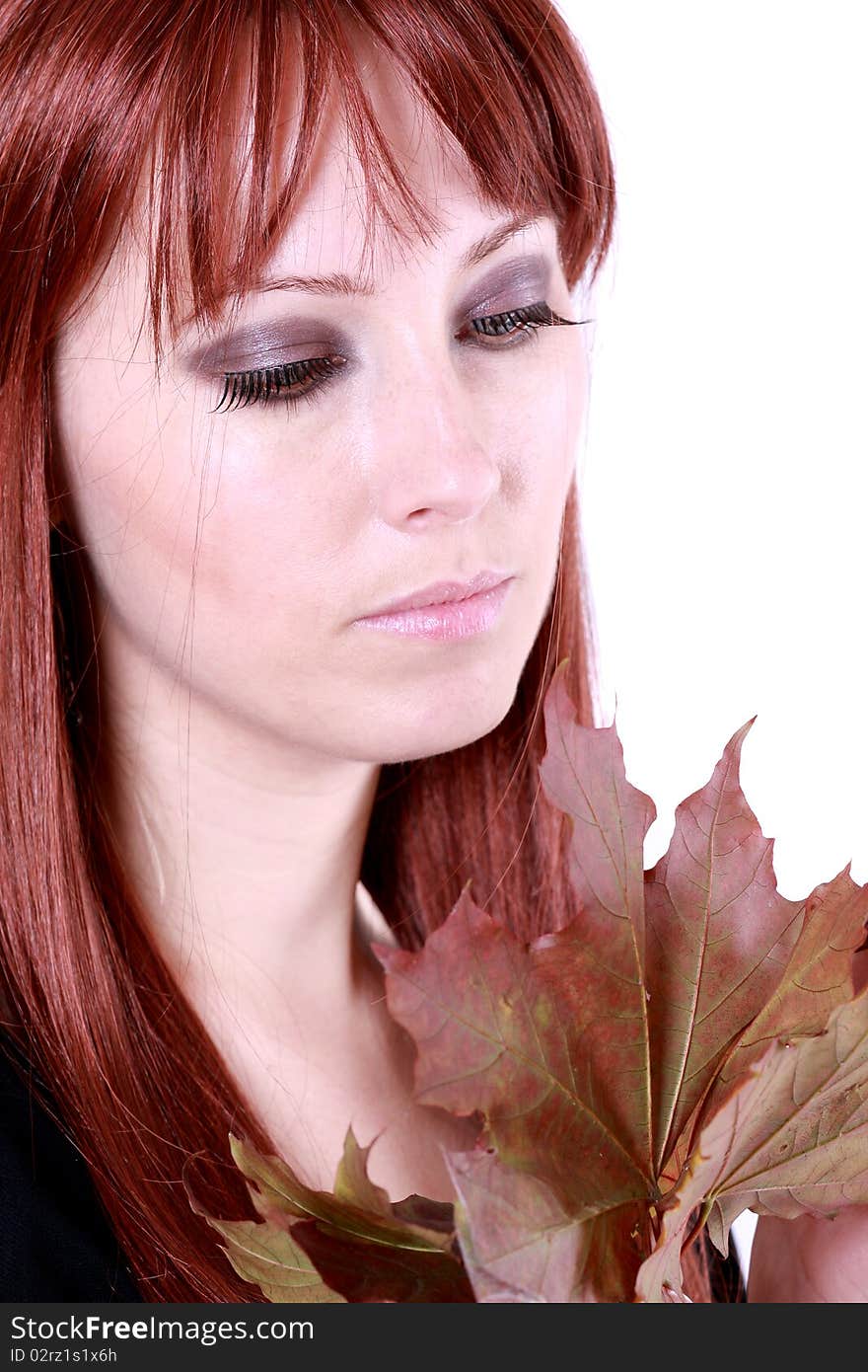 Beautiful young woman with red hair and maple leaves. Beautiful young woman with red hair and maple leaves