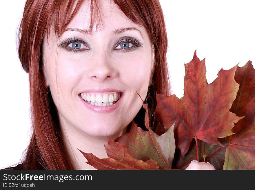 Beautiful young woman with red hair and maple leaves. Beautiful young woman with red hair and maple leaves