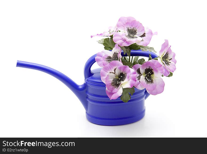 Blue plastic watering can with flower. Blue plastic watering can with flower