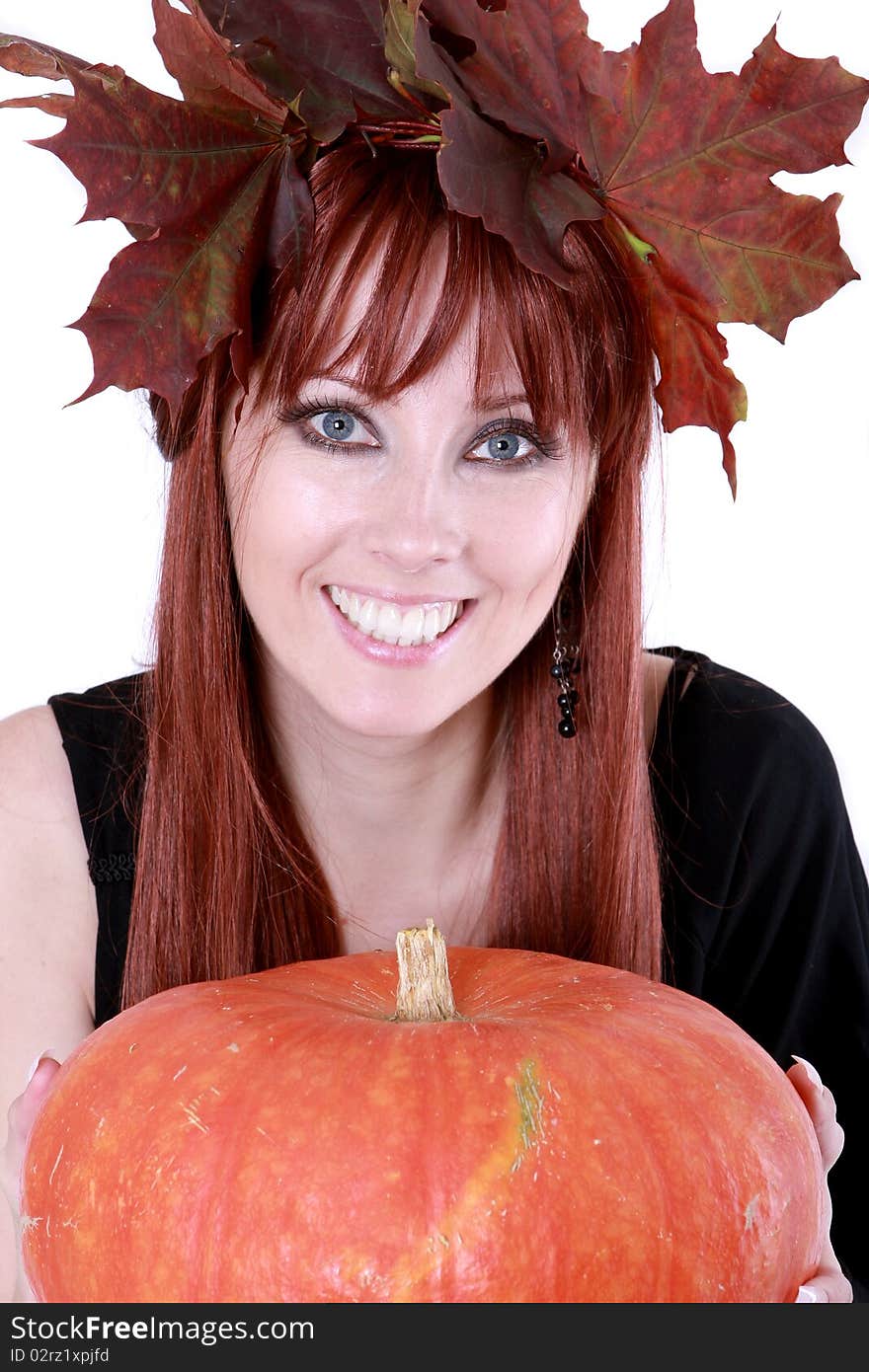 The girl with autumnal leaves and the pumpkin. The girl with autumnal leaves and the pumpkin