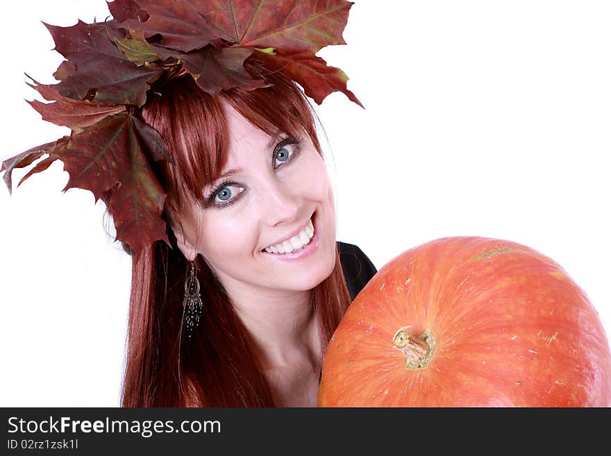 The girl with autumnal leaves and the pumpkin. The girl with autumnal leaves and the pumpkin