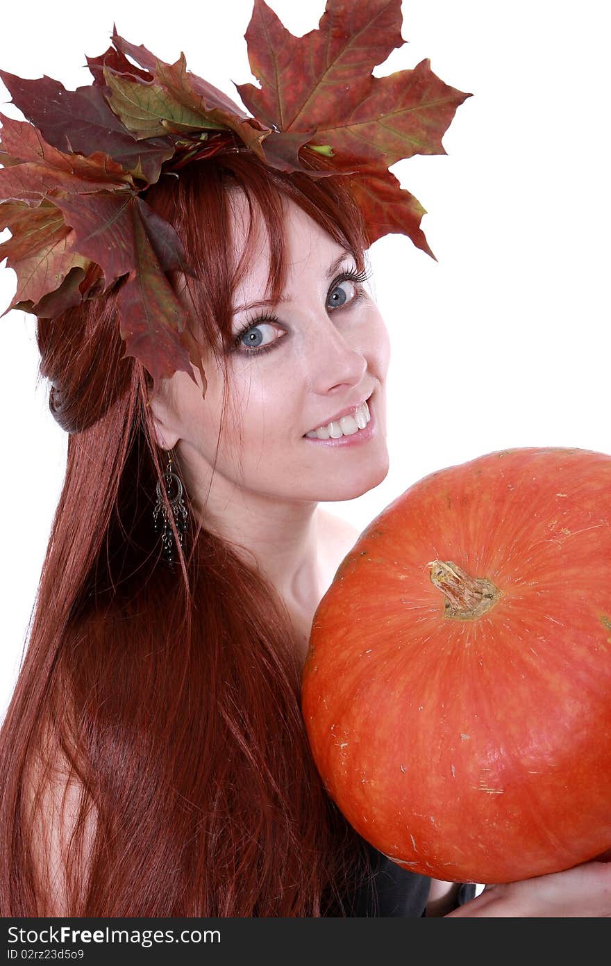 The girl with autumnal leaves and the pumpkin. The girl with autumnal leaves and the pumpkin