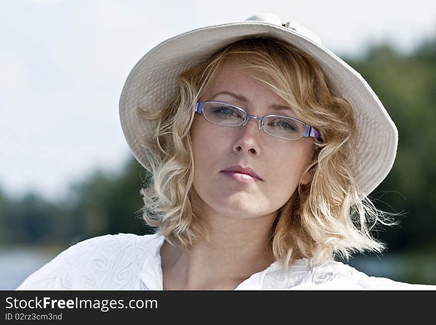 The beautiful blonde in the hat and glasses