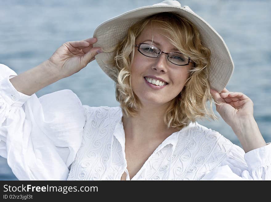 The beautiful blonde in the hat and glasses