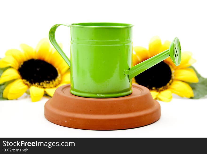 Watering can with sunflower