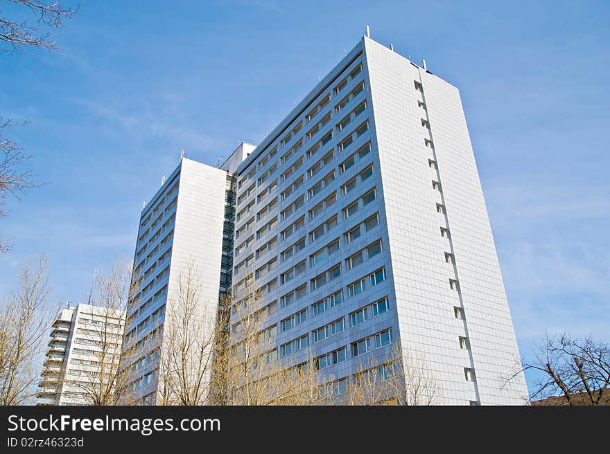 A residential building on a background of blue sky