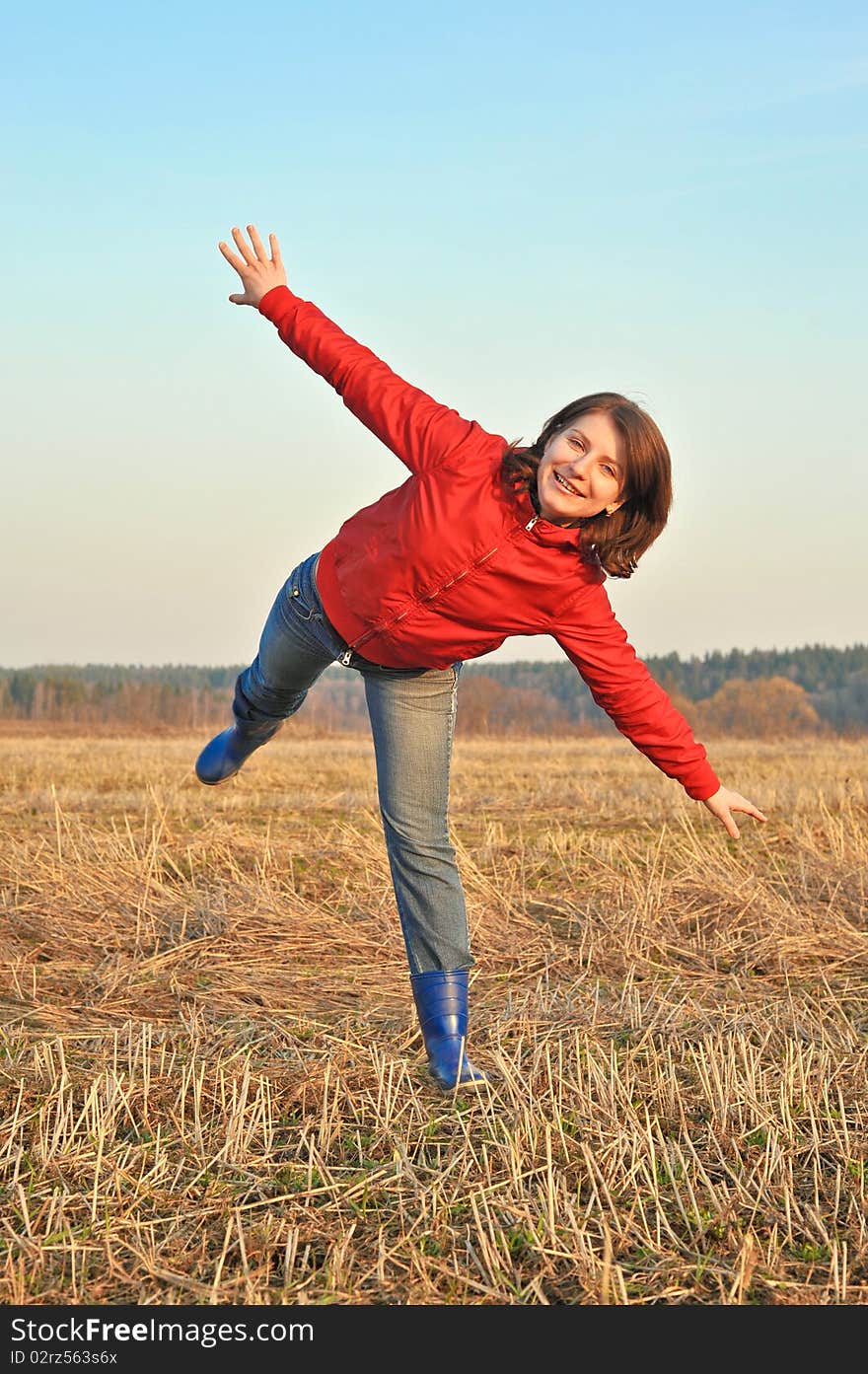 This beautiful girl is enjoying autumn nature