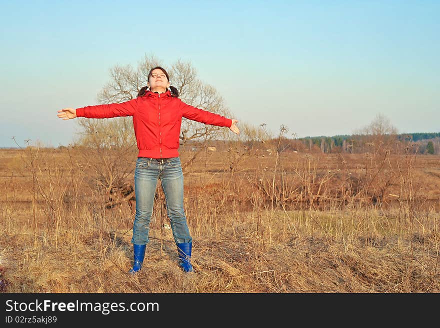 This beautiful girl is enjoying autumn nature