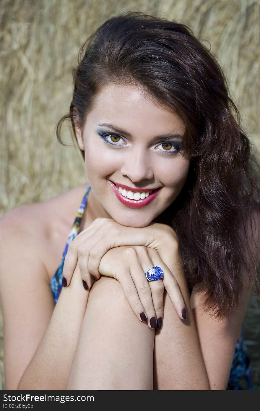 Beautiful girl near haystacks