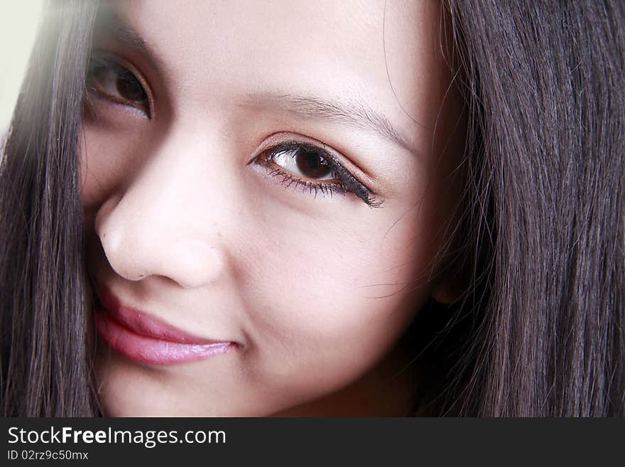 Close-up of Asian woman's face. She is a Chinese woman.