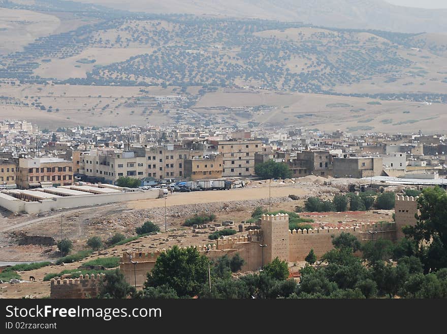 A view of Fes with the old city wall in the foreground. A view of Fes with the old city wall in the foreground