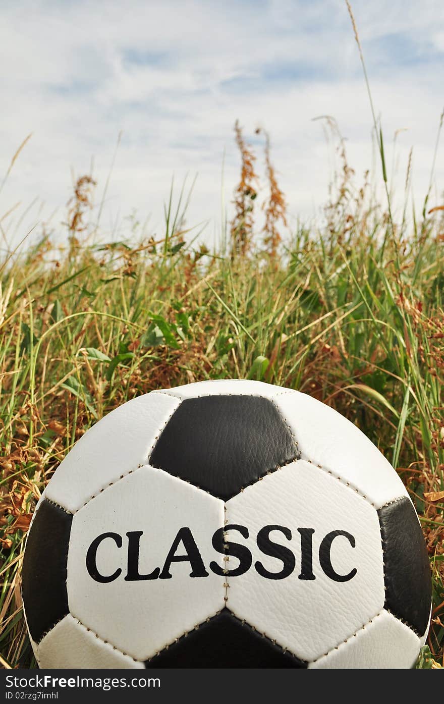 Football, Close-up with the inscription, spotted black and white, visible piercing. Football, Close-up with the inscription, spotted black and white, visible piercing