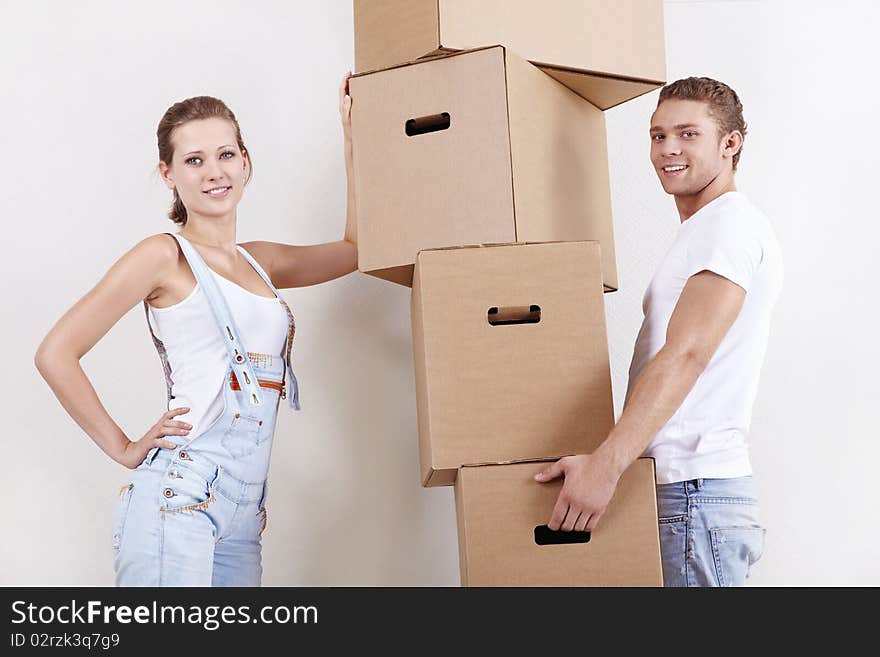 Young attractive couple with cardboard boxes. Young attractive couple with cardboard boxes