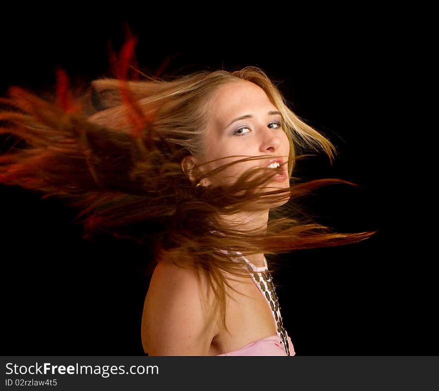 Young sexy female model with flying hair in motion. Young sexy female model with flying hair in motion.