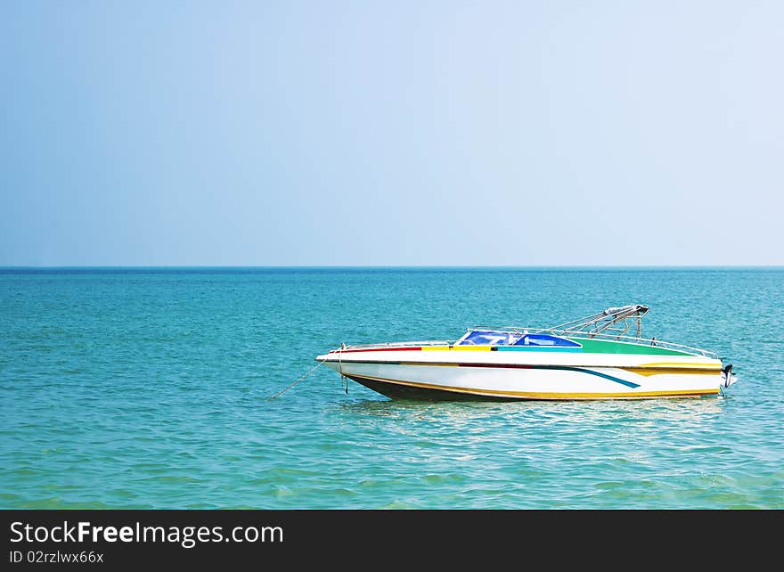 Colored vintage motorboat in a sunny day