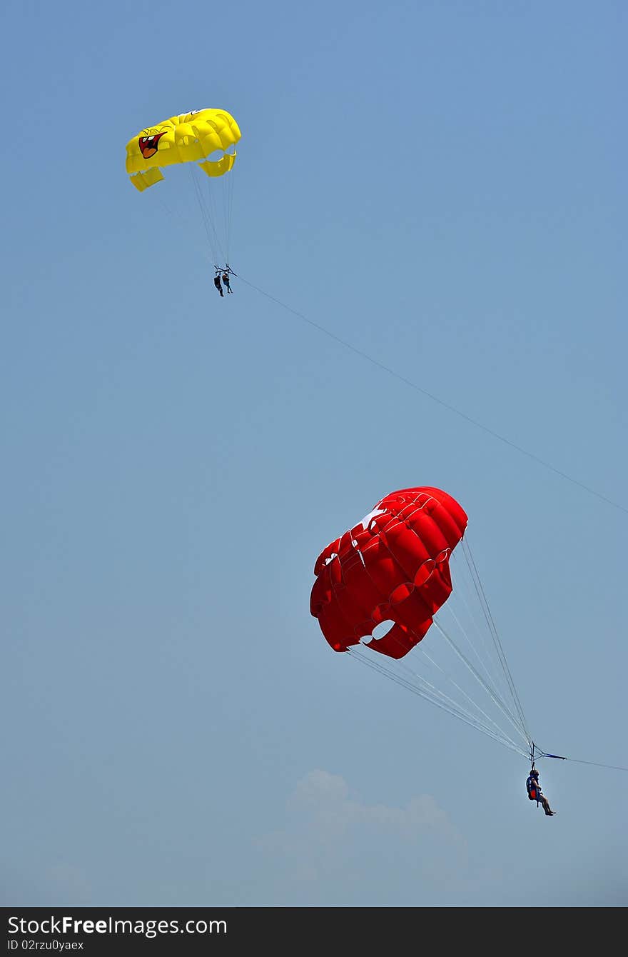 Parasailing in summer on the sea