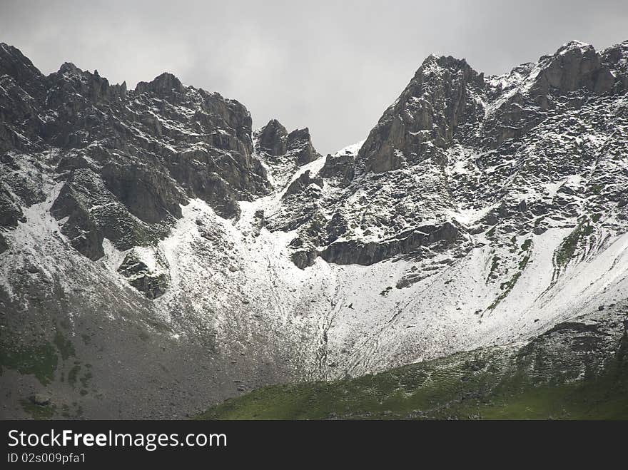 Peaks of snowcovered mountains in the alps. Peaks of snowcovered mountains in the alps