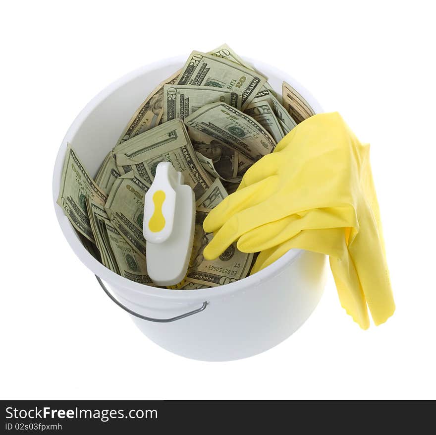 US Currency Twenty Dollar Bills in White Cleaning Bucket with scrub brush and yellow latex gloves, isolated on white background. US Currency Twenty Dollar Bills in White Cleaning Bucket with scrub brush and yellow latex gloves, isolated on white background.