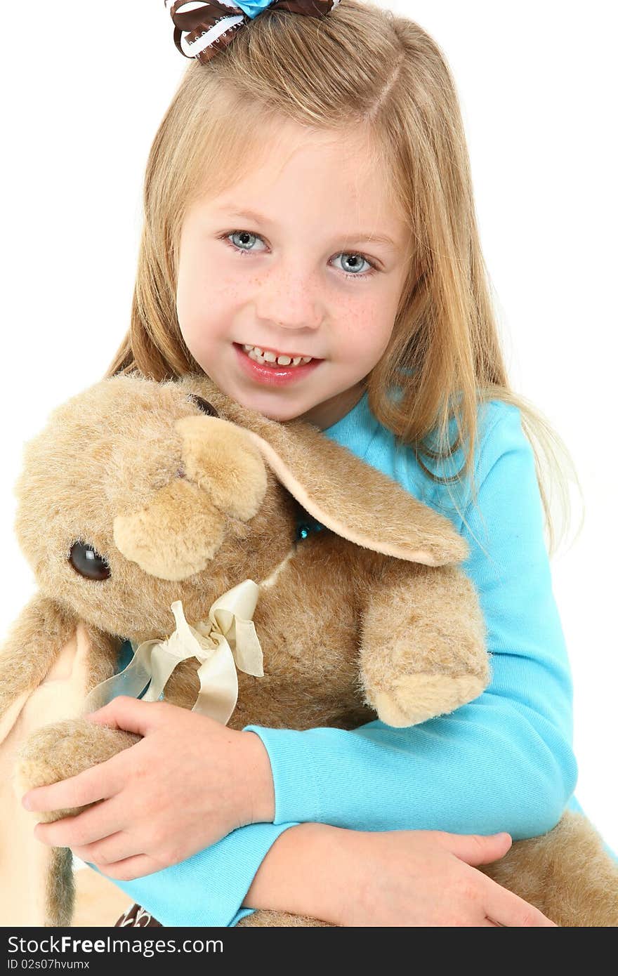 Adorable five year old american girl with brown bunny rabit over white. Adorable five year old american girl with brown bunny rabit over white