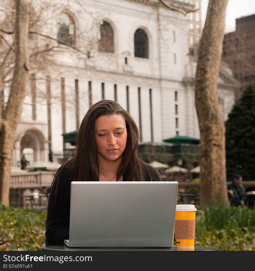 Woman With a Computer in a Park