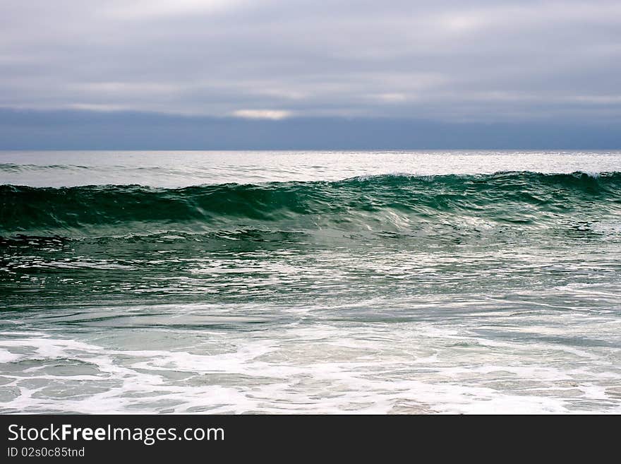 A wave growing larger by the second at a local beach in California.