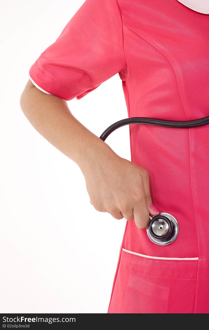 A female nurse hand want to keep the stethoscope into uniform pocket. A female nurse hand want to keep the stethoscope into uniform pocket