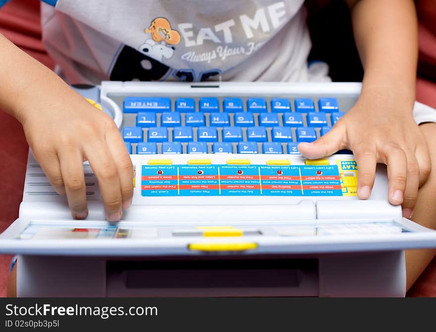 Boy hand with toy laptop. Boy hand with toy laptop