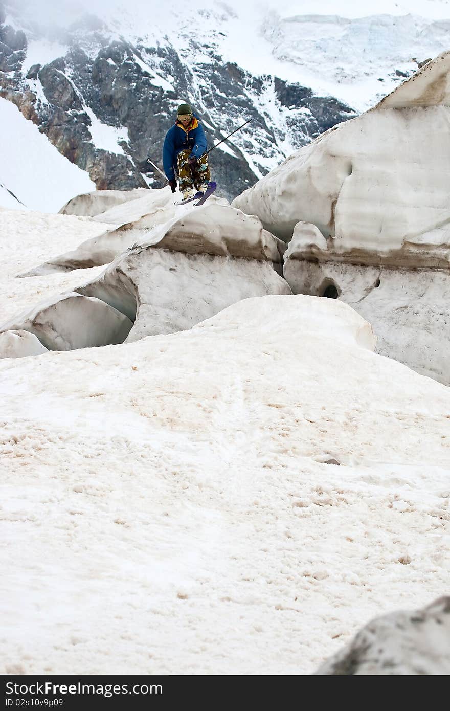 Freerider jumping in a mountains, Caucasus, Elbrus, summer