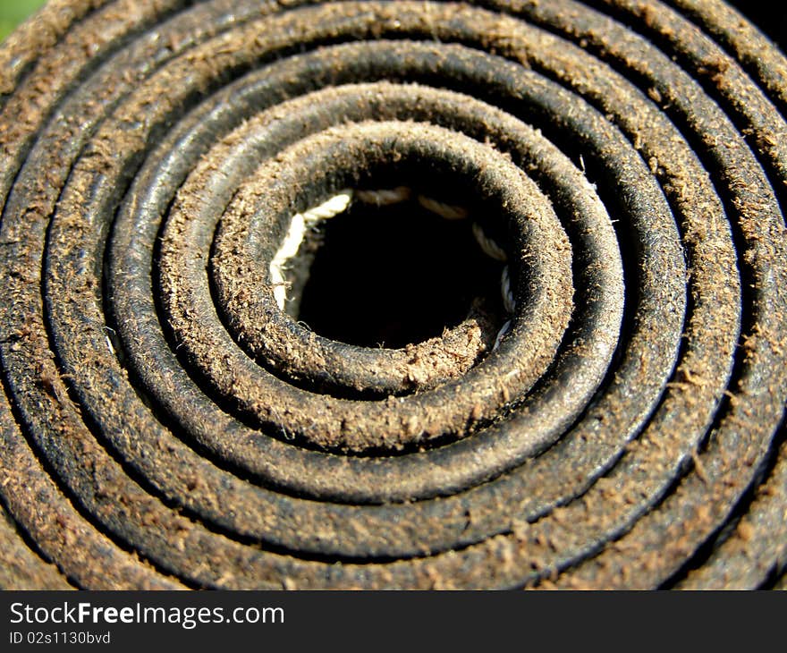 Detail photo of the rolled leather belt background. Detail photo of the rolled leather belt background