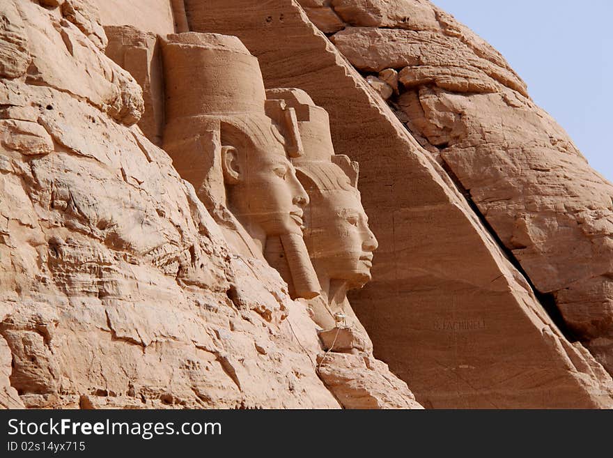 Abu Simbel temples are two massive rock temples in Nubia, southern Egypt on the western bank of Lake Nasser about 230 km southwest of Aswan (about 300 km by road). The complex is part of the UNESCO World Heritage Site known as the Nubian Monuments, which run from Abu Simbel downriver to Philae (near Aswan).