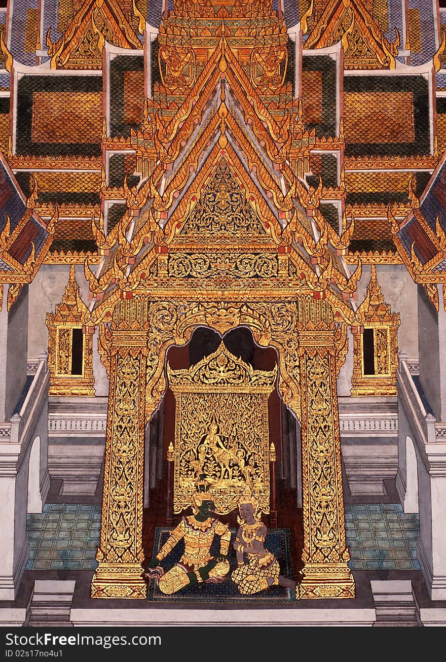 thai traditional painting, ornament and architecture in a famous temple in Bangkok, Thailand. The painting is about family. thai traditional painting, ornament and architecture in a famous temple in Bangkok, Thailand. The painting is about family.