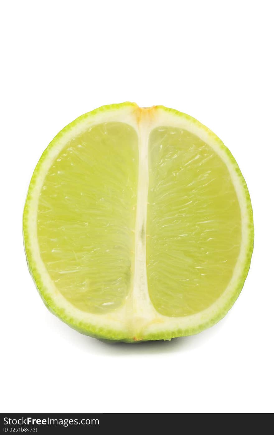 A lime cut in half isolated on a white background