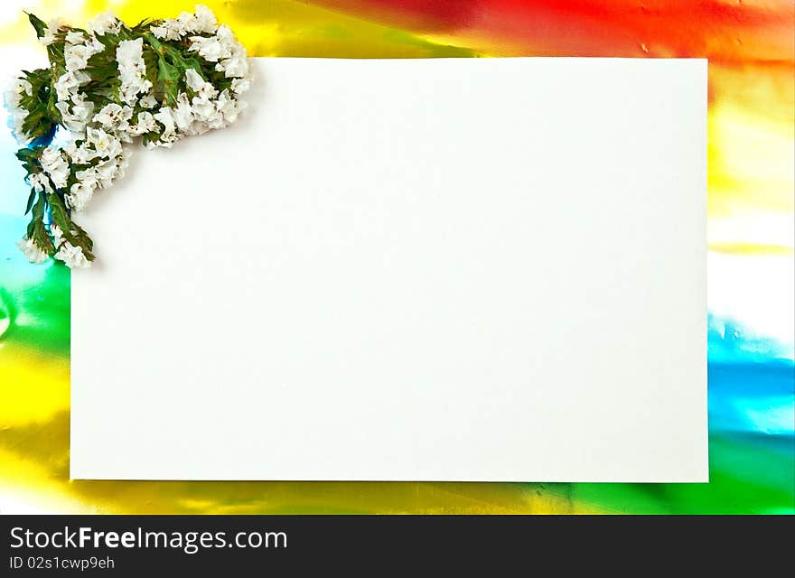 White paper blank on red with flowers design. Colored background