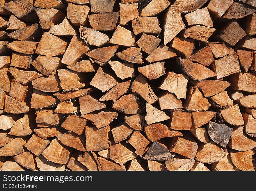 The firewood stack background texture. The firewood stack background texture