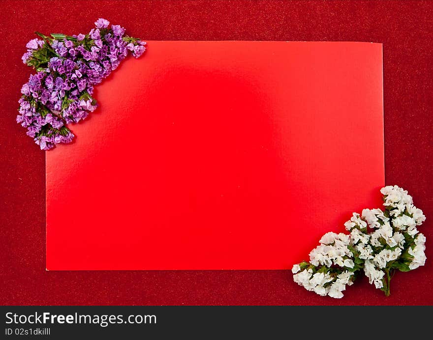 Red paper blank on green with flowers design. Red paper blank on green with flowers design