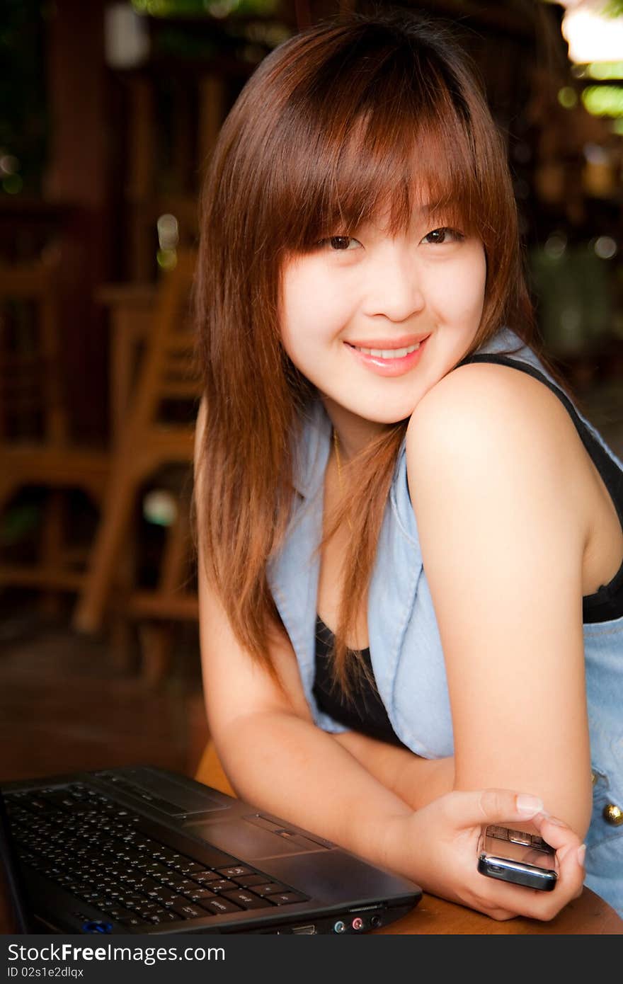 Beautiful Asian gilr and mobile phone. Beautiful Asian gilr and mobile phone