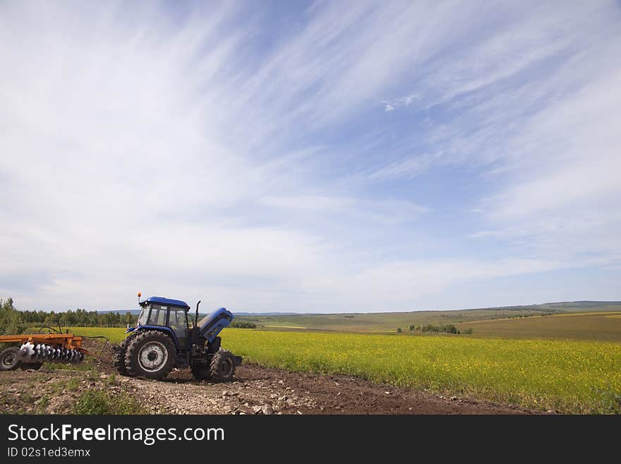 Plow machine in summer fields in China